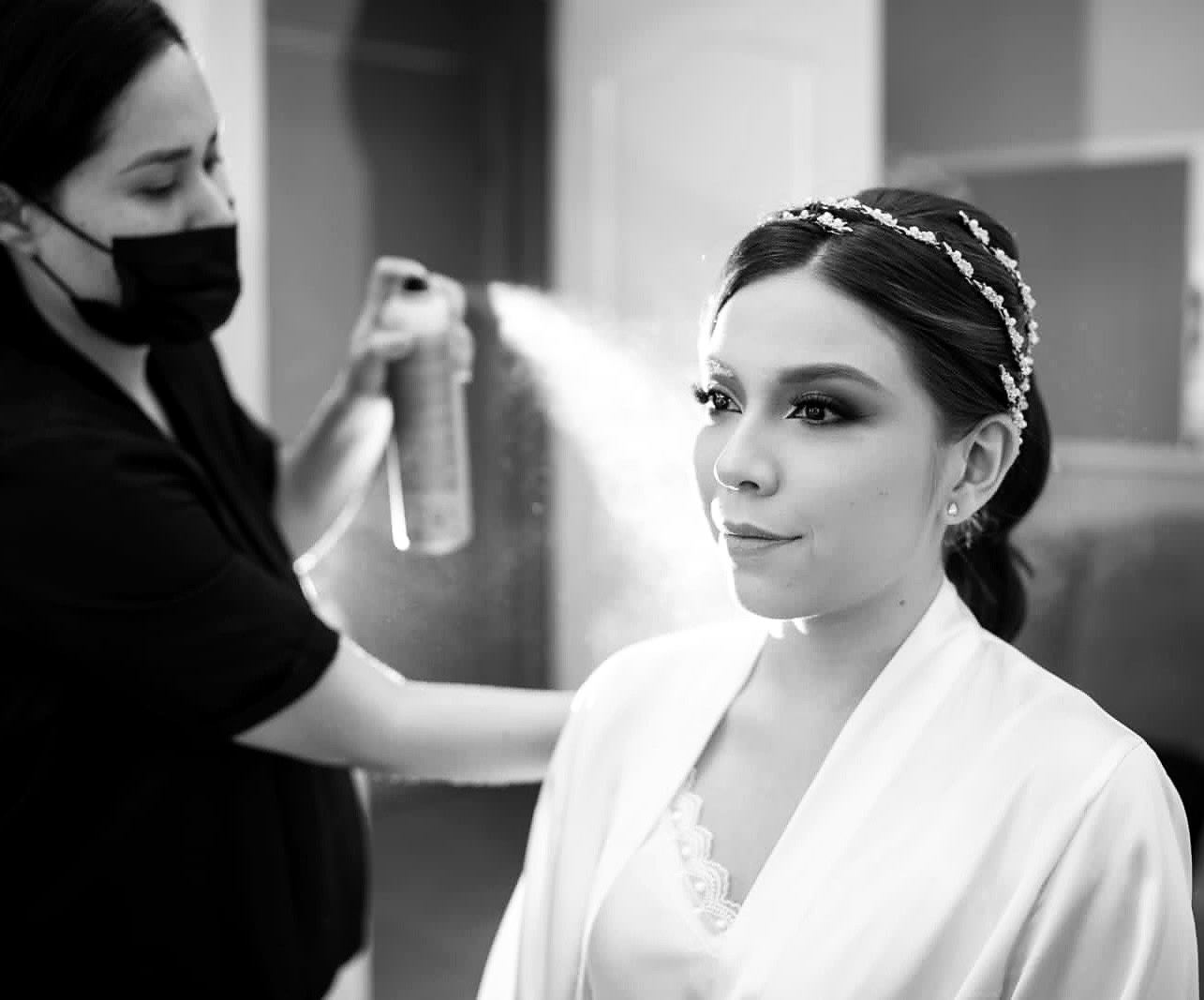 Dioseline Espinoza finishing a bridal look in Los Cabos